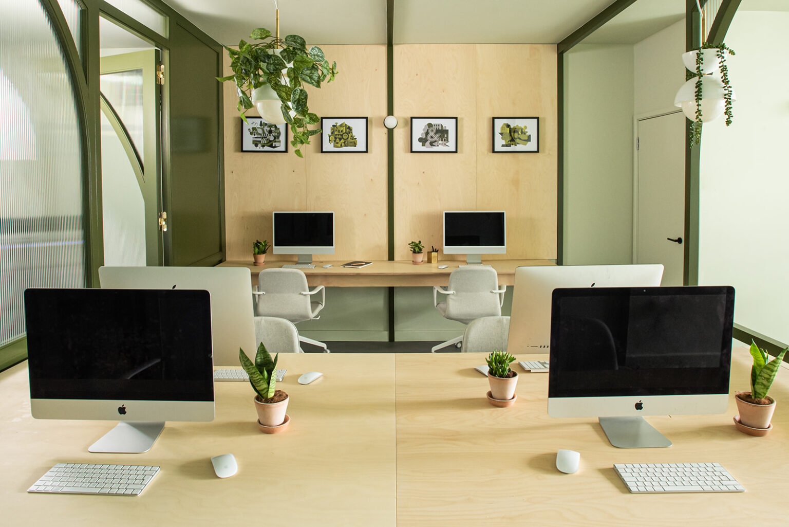 Stow Brothers South Woodford workspace with timber desks and computers